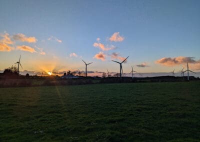 Decarb Windmills in field Ireland Sustainable Energy Upgrade The Green Star Alliance